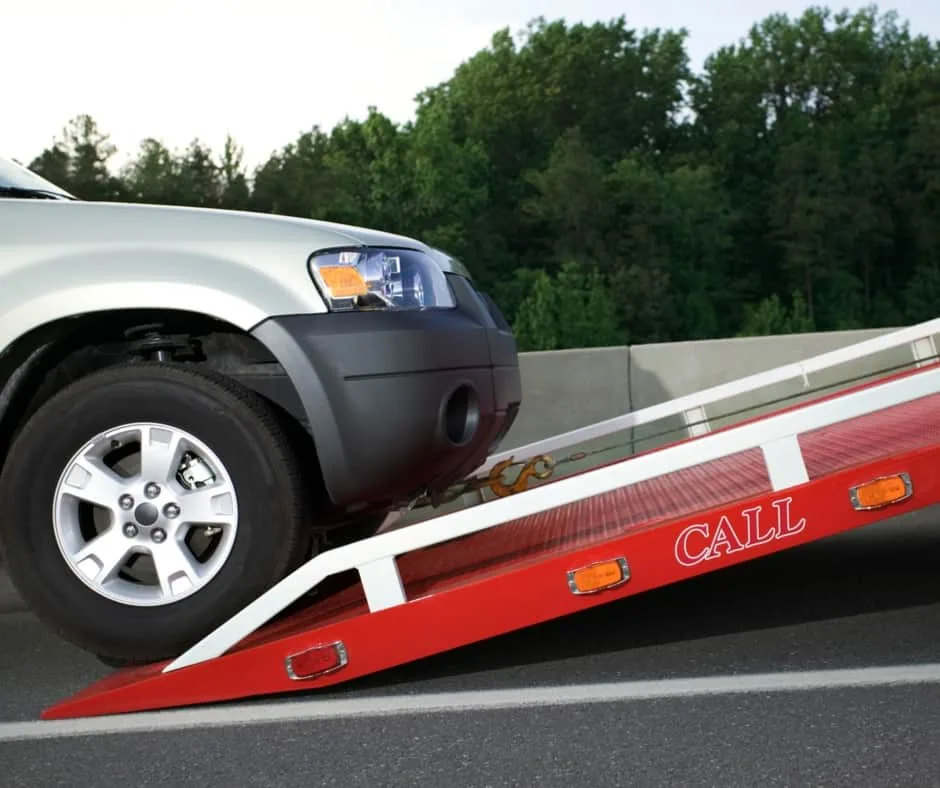 San Jose tow truck loading a vehicle on a residential street