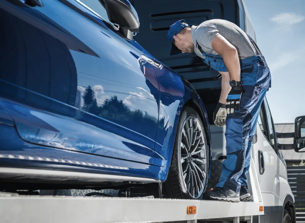 San Jose local tow truck loading vehicle